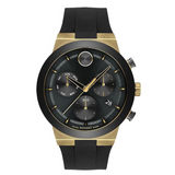 A Movado chronograph wristwatch with a black band, gold and black casing, and a digital display.