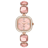 A TIMEX Fria women's watch with a white dial, round case, and pink gemstone accents on the bezel.