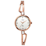 A TIMEX Fria women's analog watch with a silver round dial and rose gold brass strap, featuring a jewellery clasp.